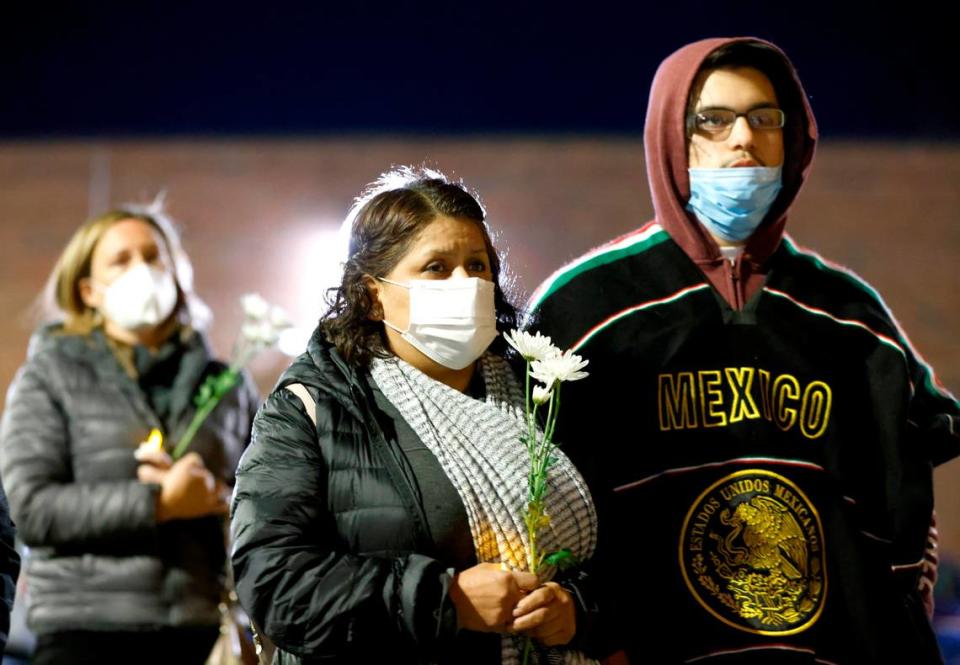 Attendees listen during a vigil for Daniel Turcios in Raleigh, N.C. January 14, 2022. Turcios was fatally shot by Raleigh police Tuesday afternoon after a crash on Interstate 440.