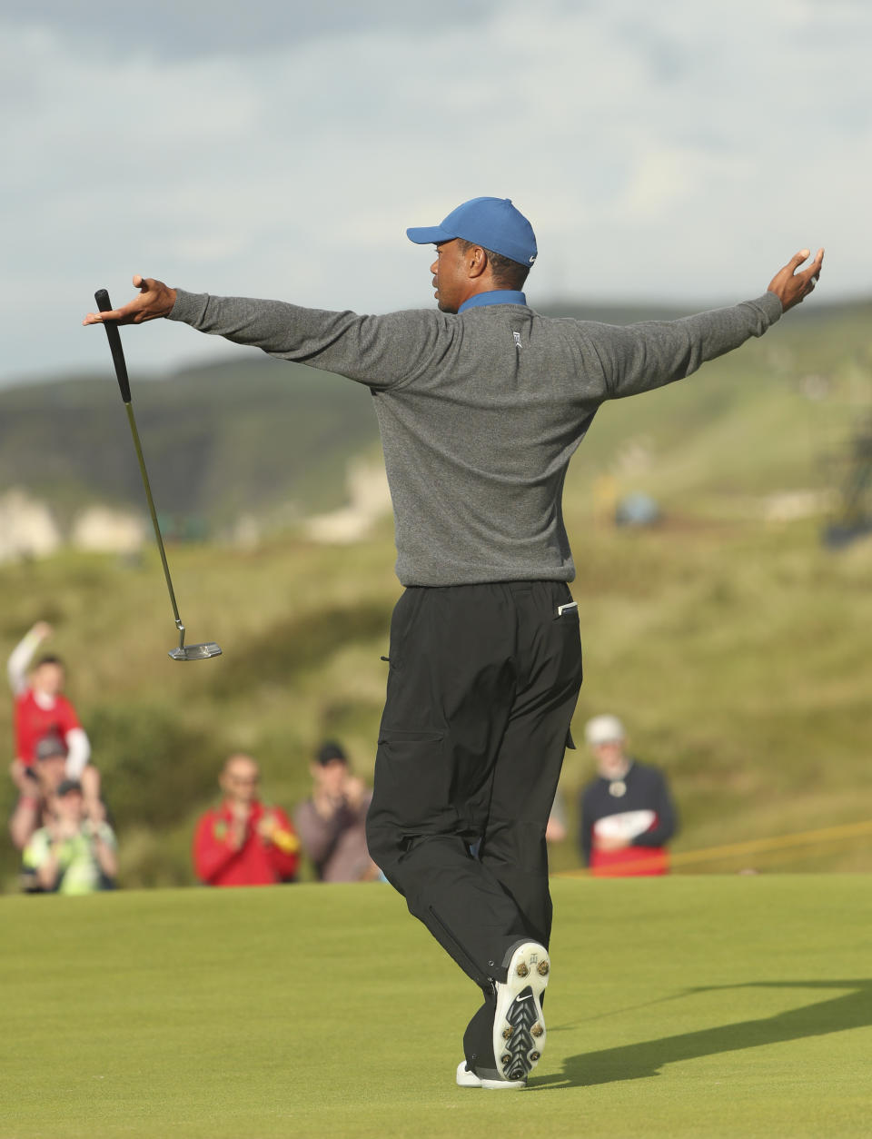 Tiger Woods of the United States celebrates after getting a birdie on the 16th green during the first round of the British Open Golf Championships at Royal Portrush in Northern Ireland, Thursday, July 18, 2019.(AP Photo/Jon Super)