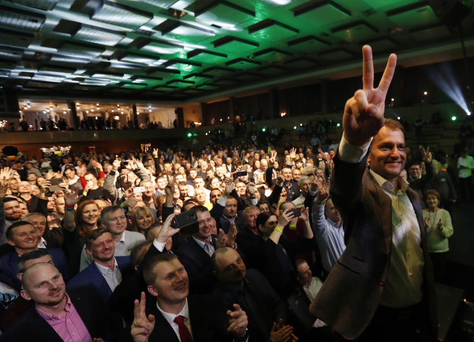 Leader of the Ordinary People and Independent Personalities party Igor Matovic strikes a V-sign after acknowledging preliminary results of the general election in Trnava, Slovakia, Sunday, March 1, 2020. (AP Photo/Petr David Josek)