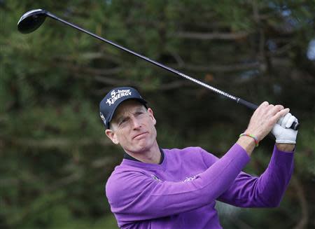 Jim Furyk of the U.S. hits from the fourth tee during the final round of the BMW Championship golf tournament at the Conway Farms Golf Club in Lake Forest, Illinois, September 16, 2013. REUTERS/Jim Young