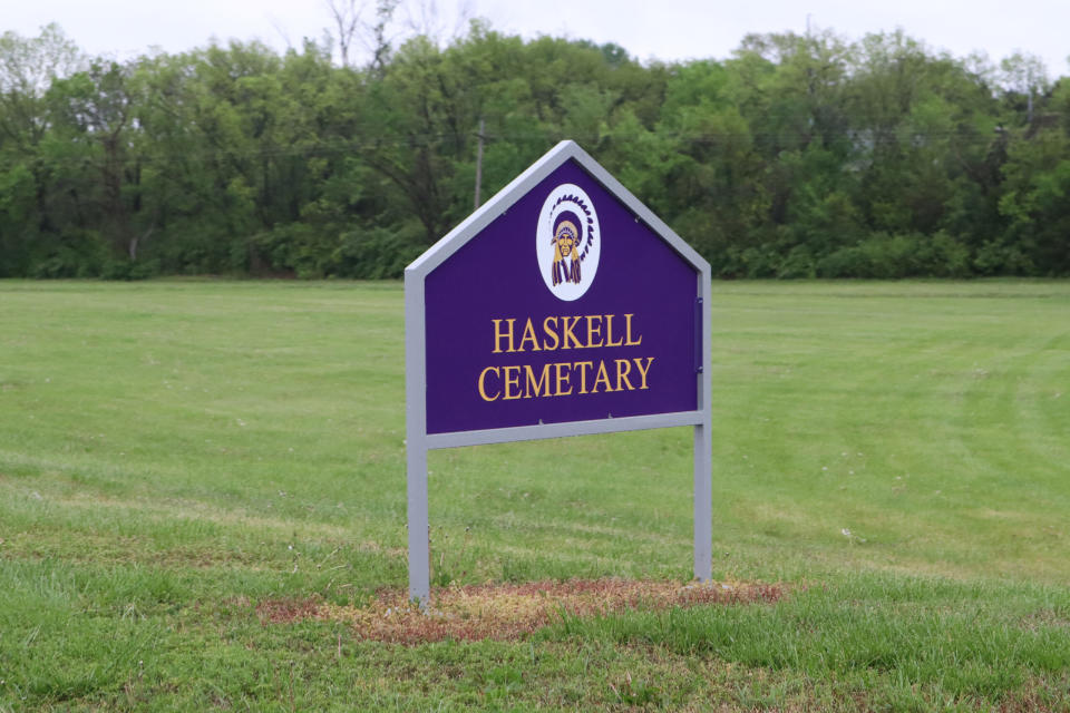 A sign at the entrance to the lane leading to the cemetery holding the remains of 103 Native American children. The children died in the early yeaers of the institution's history, when it was a federal boarding school. 