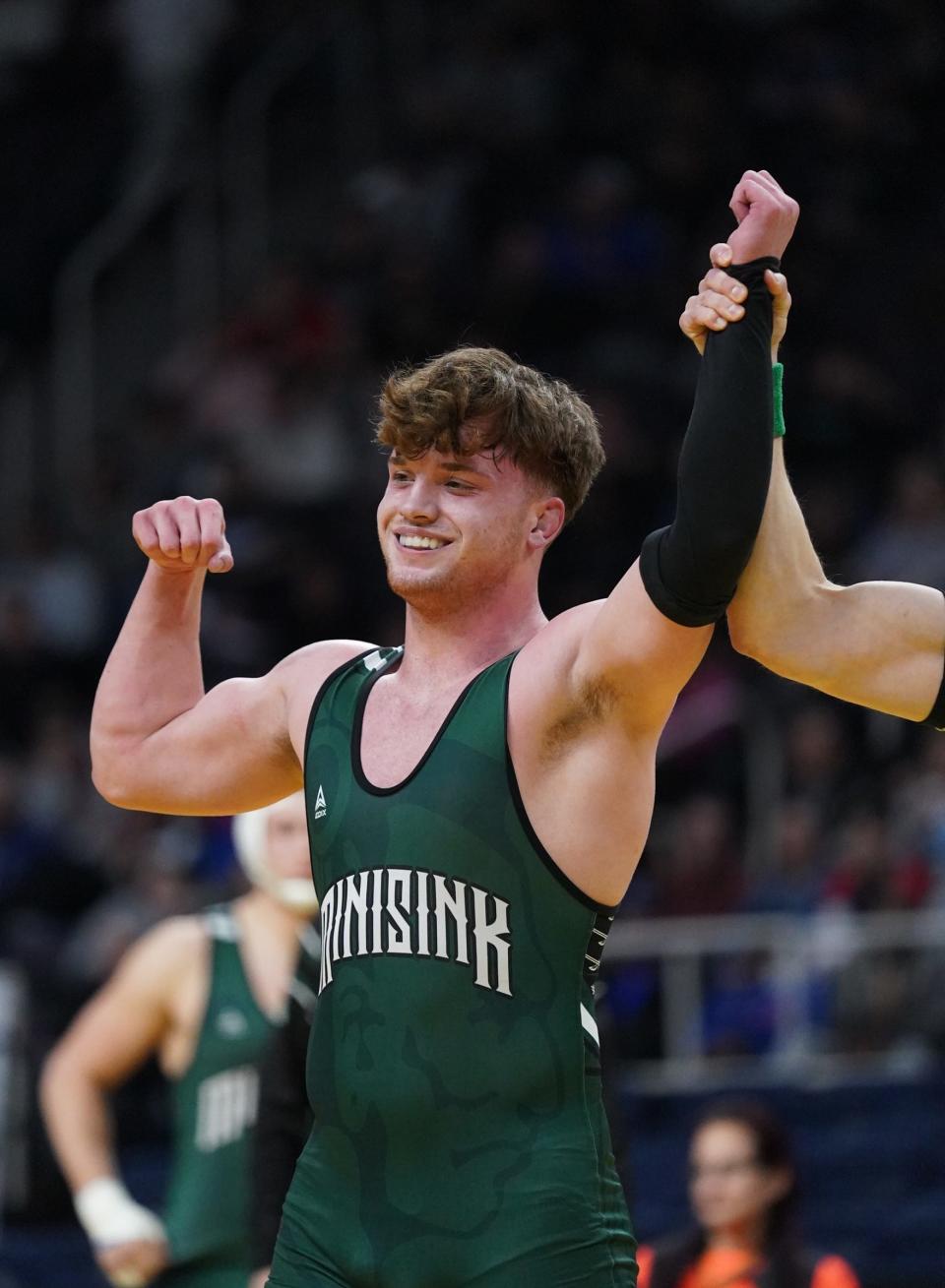 Minisink Valley's Zack Ryder has his arm raised in victory after dispatching Hilton's Elijah Diakomihalis in the Division 1 189-pound championship match in Albany on Saturday.