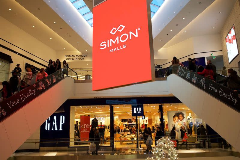 Shoppers ascend and descend escalators at the King of Prussia Mall, owned by Simon Property Group, United State's largest retail shopping space, in King of Prussia