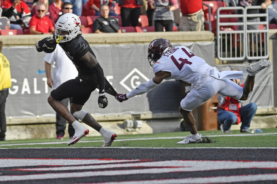 Virginia Tech cornerback Dorian Strong (44) attempts to stop Louisville wide receiver Jadon Thompson (2) from scoring during the second half of an NCAA college football game in Louisville, Ky., Saturday, Nov. 4, 2023. Louisville won 34-3. (AP Photo/Timothy D. Easley)