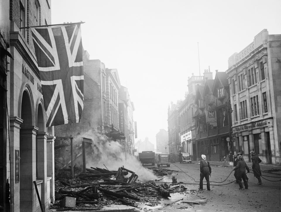 Britain At War 1939-45, A Union Flag hangs defiantly from a building, 16 November 1940, in the aftermath of the air raid which devastated the centre of Coventry on the night of 14/15 November 1940. (Photo by Mr Taylor/ Imperial War Museums via Getty Images)