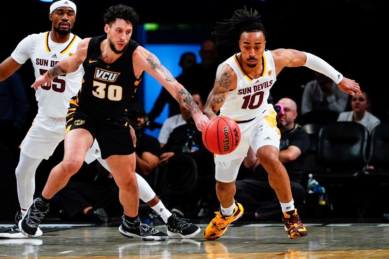 Virginia Commonwealth's Brandon Johns Jr. (30) fights for control of the ball with Arizona State's Frankie Collins (10) during the first half of an NCAA college basketball game at the Legends Classic Wednesday, Nov. 16, 2022, in New York. (AP Photo/Frank Franklin II)