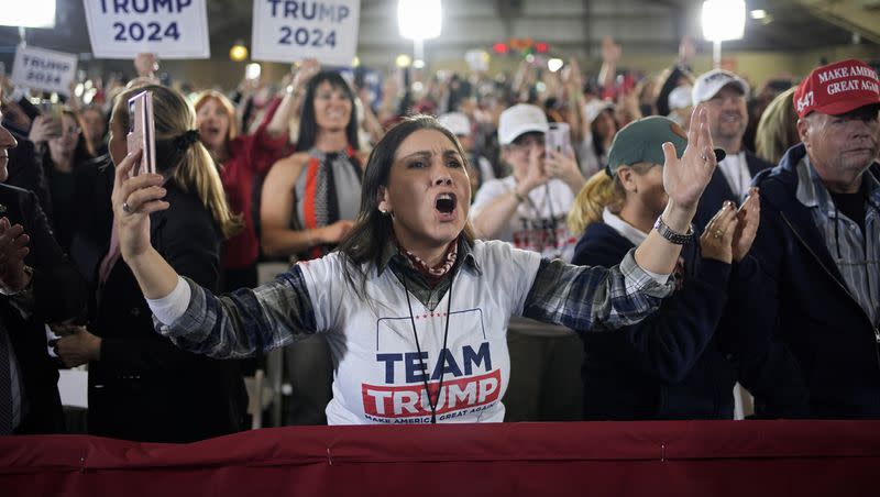 A woman cheers as former President Donald Trump speaks at a campaign event on Jan. 27, 2024, in Las Vegas. Trump continues to be the solid front-runner in the GOP primary polls, setting up a possible rematch with President Joe Biden.