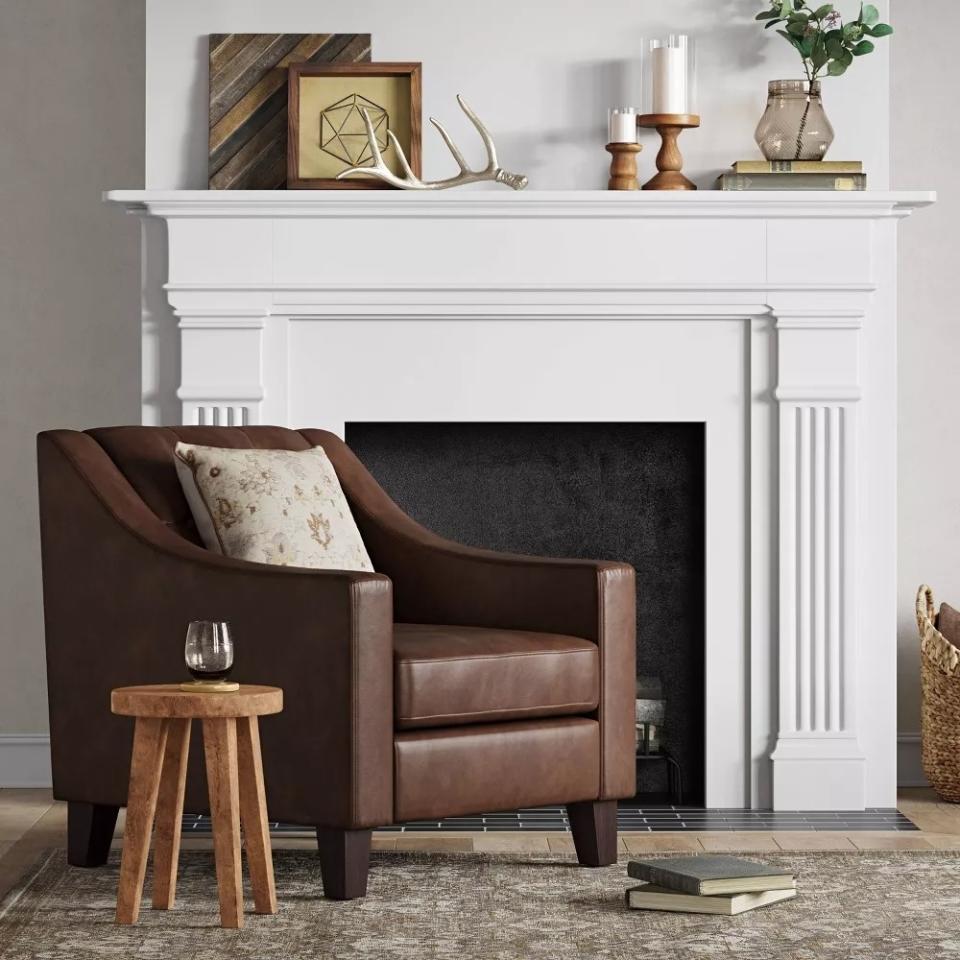 the wooden table next to a leather armchair