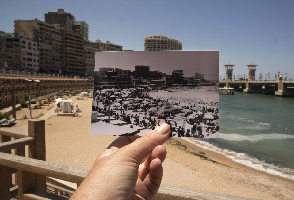 This Aug. 10, 2019 photo, shows Stanley Beach in Alexandria, Egypt, at the same site of a 1933 photograph, foreground. Alexandria, which has survived invasions, fires and earthquakes since it was founded by Alexander the Great more than 2,000 years ago, now faces a new menace from climate change. Rising sea levels threaten to inundate poorer neighborhoods and archaeological sites, prompting authorities to erect concrete barriers out at sea to hold back the surging waves. (AP Photo/Maya Alleruzzo)