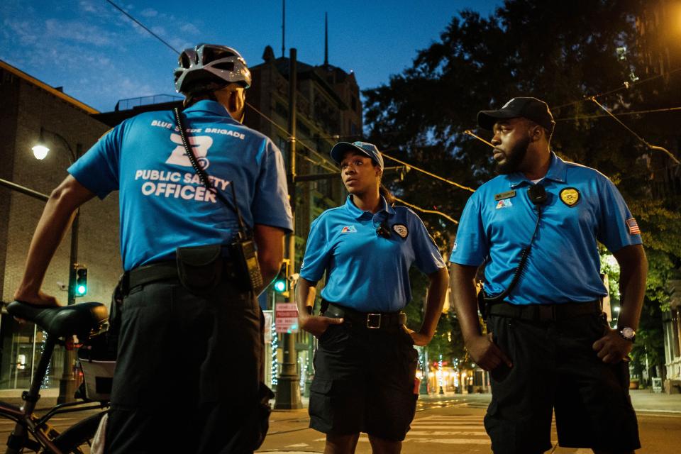 In response to a reduction in police officers, the Blue Suede Brigade, a private security force, patrols the tourist areas in Memphis. From left, Blue Suede Brigade members Kcbena Cash, Tamala Johnson and Nathaniel Lewis worked the night shift.