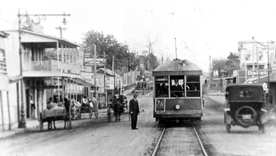 An image of Sixth Street during the early 1900s reveals several of its historical roles.