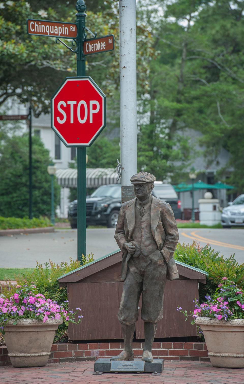 A statue of golf course architect Donald Ross stands in the village of Pinehurst. 