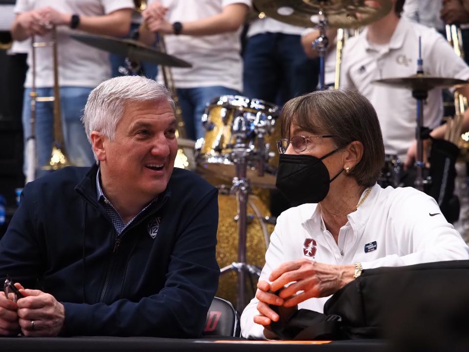 Pac-12 commissioner George Kliavkoff speaks with Stanford women's basketball coach Tara VanDerveer.