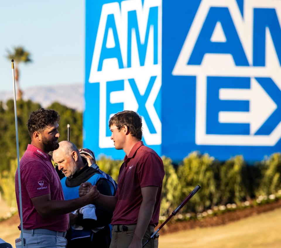 Jon Rahm (left) shakes hands with Davis Thompson after finishing the final round of The American Express on the Pete Dye Stadium Course at PGA West in La Quinta, Calif., Sunday, Jan. 22, 2023.