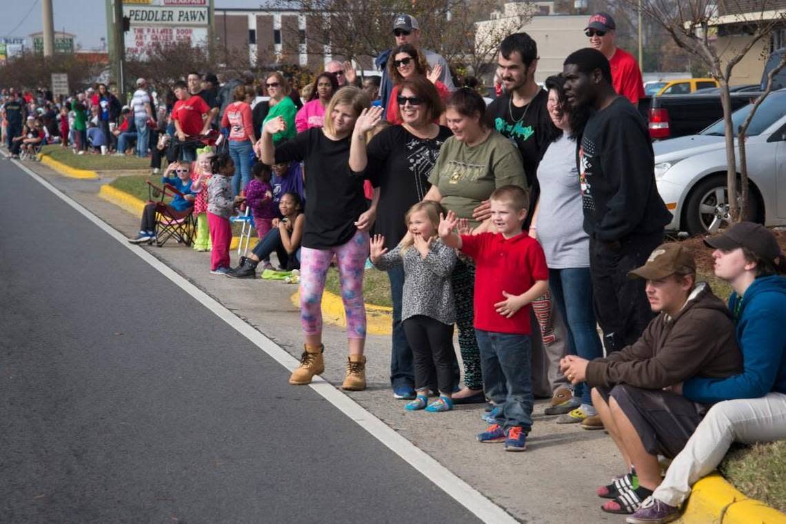 The crowd on Watson Boulevard waves at Santa Claus during the Robins Regional Christmas Parade in this Telegraph file photo.