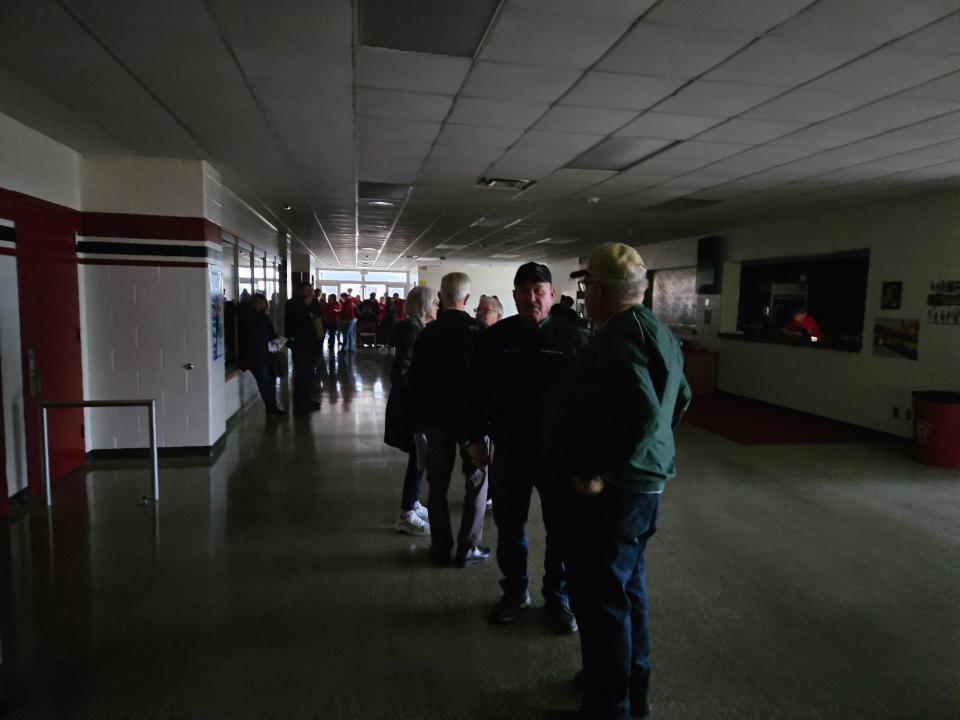 Fans, parents and players are huddled while waiting whether games will be canceled after a power outage affects the IHSAA Class 3A Girls Basketball Sectionals at Twin Lakes High School on Wednesday, Jan. 31, 2024.