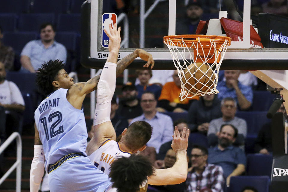 Next time, Aron Baynes should just let Ja Morant go. (AP Photo/Ross D. Franklin)