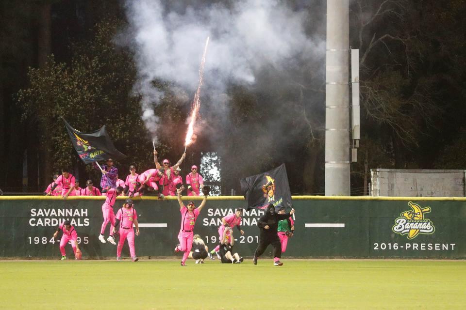 The Party Animals storm over the outfield wall during Banana Fest on Saturday February 25, 2023 at Historic Grayson Stadium.