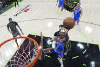 Oklahoma City Thunder guard Shai Gilgeous-Alexander (2) goes to the basket in the first half of Game 4 of an NBA basketball first-round playoff series against the New Orleans Pelicans in New Orleans, Monday, April 29, 2024. (AP Photo/Gerald Herbert)