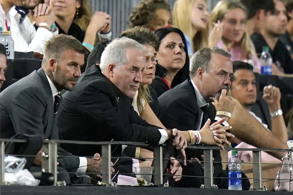 David Beckham, left, owner and president of soccer operations for Inter Miami, and Jorge Mas, second from left, managing owner, watch during the first half of the team's MLS soccer match against Montreal, Wednesday, May 12, 2021, in Fort Lauderdale, Fla. (AP Photo/Lynne Sladky)