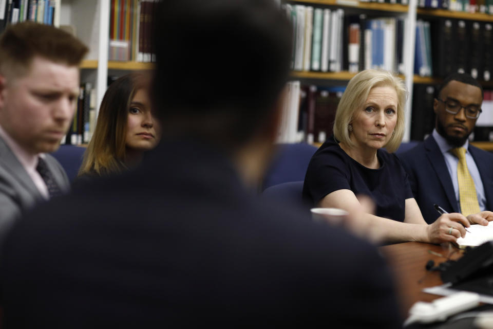 Democratic presidential candidate Sen. Kirsten Gillibrand, D-N.Y., second from right, listens while meeting with law students at a legal clinic at the University of Nevada, Las Vegas, Thursday, March 21, 2019, in Las Vegas. The legal clinic works with unaccompanied immigrant children.(AP Photo/John Locher)