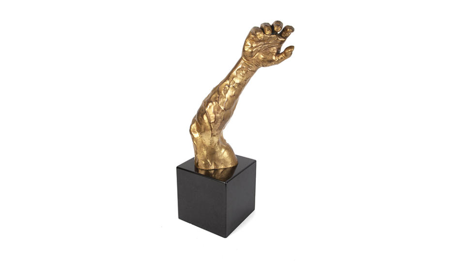 An arm sculpture from “Cliffhanger” - Credit: Julien's Auctions