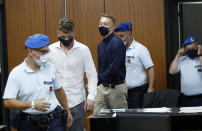 Gabriel Natale-Hjorth, second from left, and Finnegan Lee Elder, from California, arrive in court for a hearing in their trial where they are accused of slaying a plainclothes Carabinieri officer while on vacation in Italy last summer, in Rome, Wednesday, Sept. 16, 2020. (Remo Casilli/Pool Photo via AP)