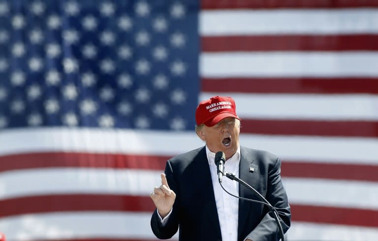 Republican presidential candidate Donald Trump speaks to people gathered at Fountain Park during a campaign rally on March 19, 2016 in Fountain Hills, Arizona