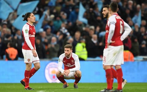 Shkodran Mustafi reacts after the defeat to Man city  - Credit: Getty images