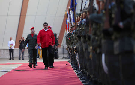 Venezuela's President Nicolas Maduro (C) receives military honors at Maiquetia airport, in Caracas, Venezuela October 20, 2016. Miraflores Palace/Handout via REUTERS