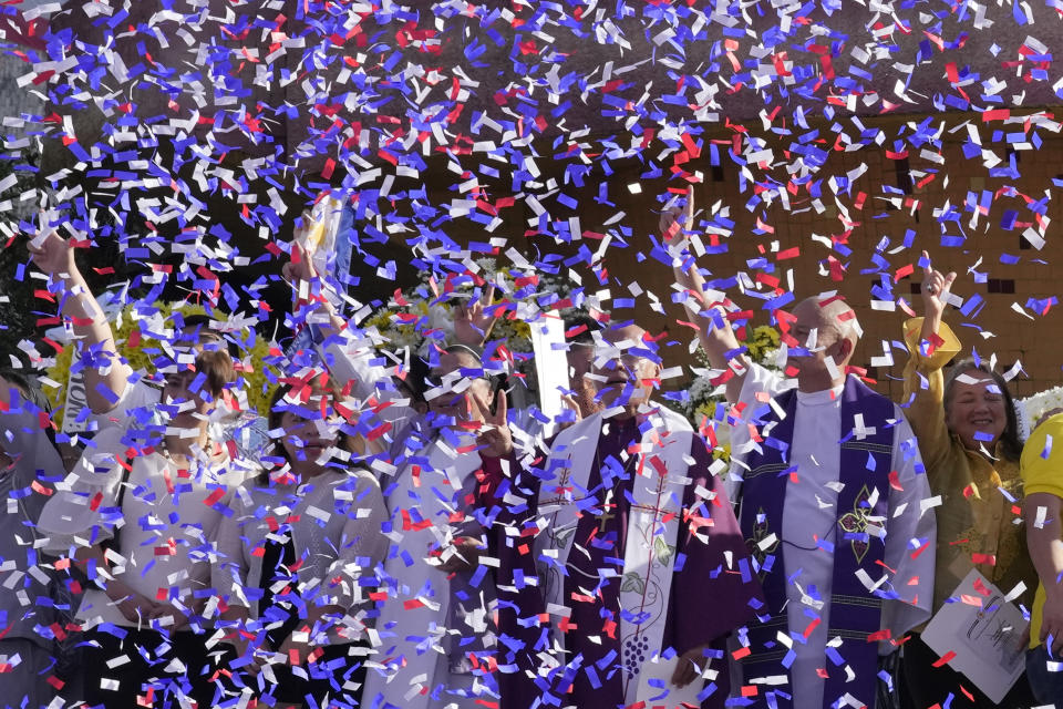 Confetti fall during ceremonies marking the 37th anniversary of the near-bloodless coup popularly known as "People Power" revolution that ousted the late Philippine dictator Ferdinand Marcos from 20-year-rule at the People's Power Monument in Quezon city, Philippines on Saturday Feb. 25, 2023. It is the first year marking the event under the rule of Marcos Jr. (AP Photo/Aaron Favila)