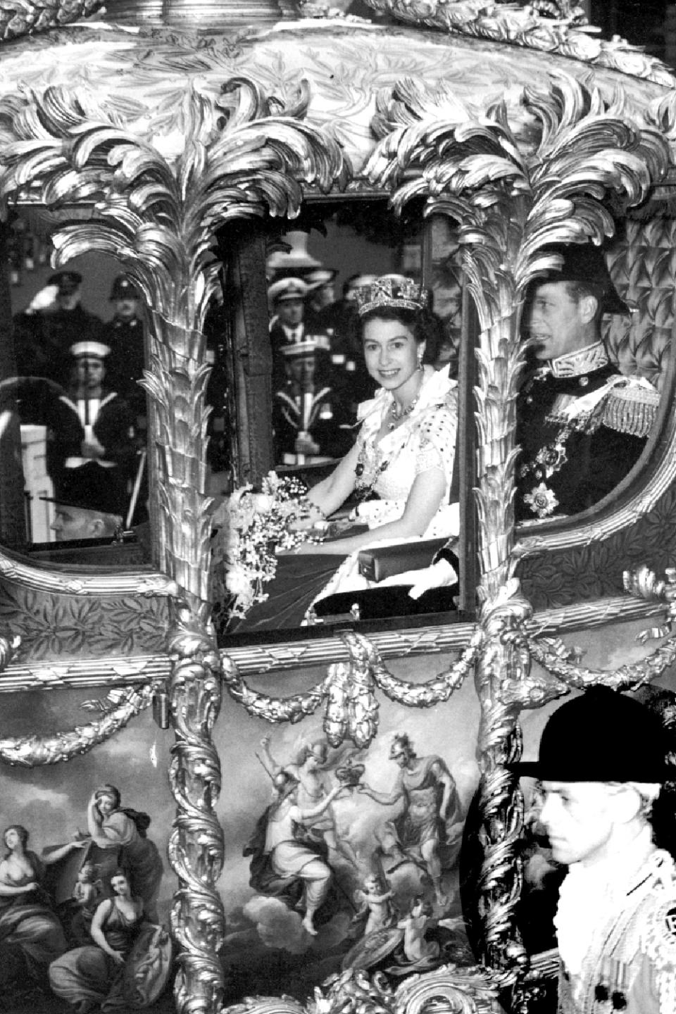 Queen Elizabeth II with Prince Philip, Duke of Edinburgh, in the Coronation Coach en route to Westminster Abbey