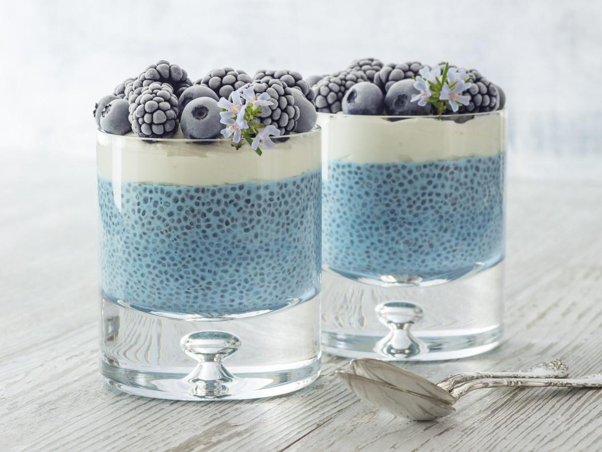 Vegan Blue Spirulina Chia Pudding with Coconut Cream and Frozen Berries