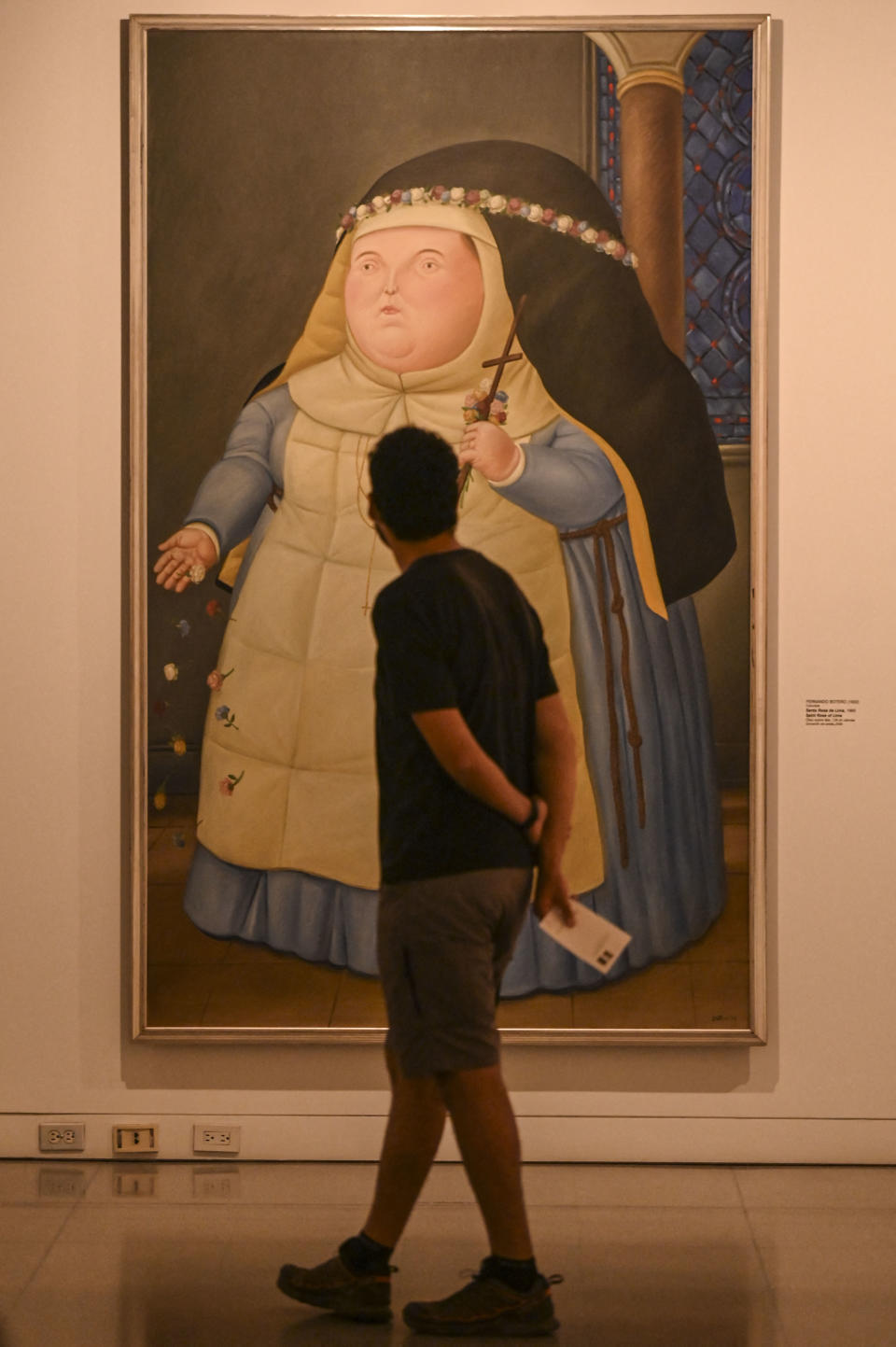 A man tours an exhibition of Colombian artist Fernando Botero during the celebration of his 90th birthday at the Museum of Antioquia in Medellin, Colombia on April 19, 2022. - RESTRICTED TO EDITORIAL USE - MANDATORY MENTION OF THE ARTIST UPON PUBLICATION - TO ILLUSTRATE THE EVENT AS SPECIFIED IN THE CAPTION (Photo by JOAQUIN SARMIENTO / AFP) / RESTRICTED TO EDITORIAL USE - MANDATORY MENTION OF THE ARTIST UPON PUBLICATION - TO ILLUSTRATE THE EVENT AS SPECIFIED IN THE CAPTION / RESTRICTED TO EDITORIAL USE - MANDATORY MENTION OF THE ARTIST UPON PUBLICATION - TO ILLUSTRATE THE EVENT AS SPECIFIED IN THE CAPTION (Photo by JOAQUIN SARMIENTO/AFP via Getty Images)