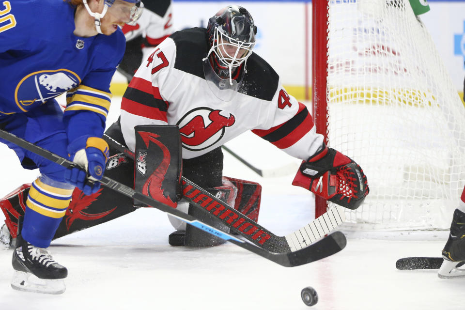 New Jersey Devils goalie Aaron Dell (47) watches the puck during the second period of the team's NHL hockey game against the Buffalo Sabres, Thursday, April 8, 2021, in Buffalo, N.Y. (AP Photo/Jeffrey T. Barnes)