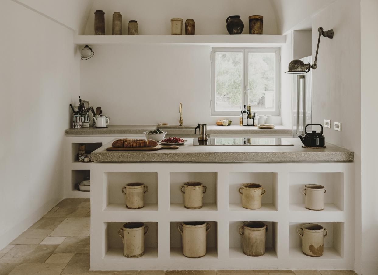  A kitchen with storage within the island. 