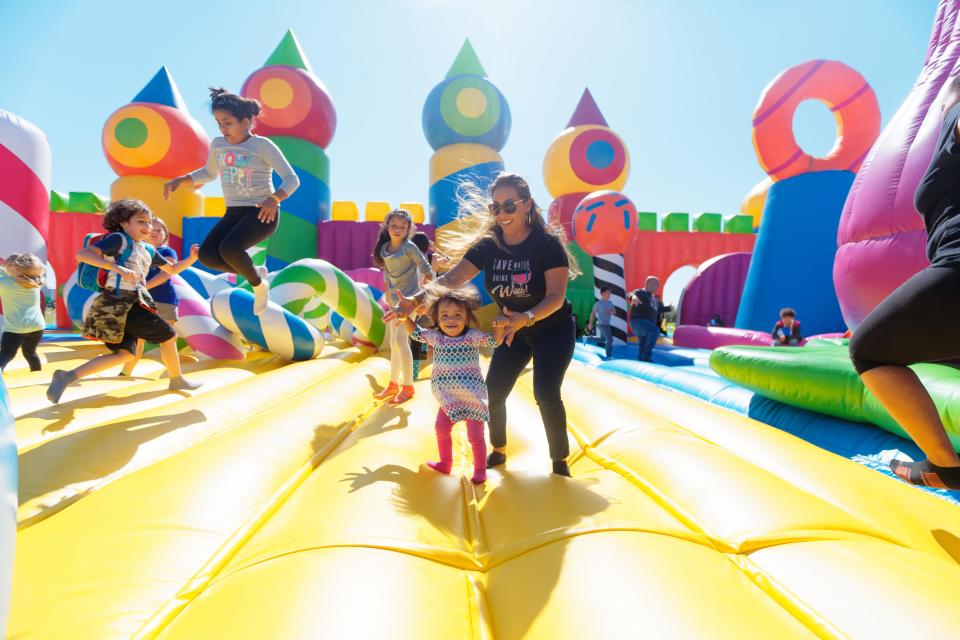 Mother-daughter duo enjoys inflatable from The Big Bounce America. The 2024 tour brings the fun to the Louisville area at Sportsdrome Speedway in Clarksville, Indiana from Friday, May 3 to Sunday, May 5, 2024, just in time for the 150th Kentucky Derby.