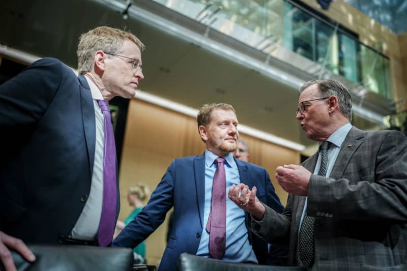 (L-R) Minister President of Schleswig-Holstein Daniel Guenther, and Minister President of Saxony Michael Kretschmer stand together with Minister President of Thuringia Bodo Ramelow at the start of the Bundesrat meeting. Kay Nietfeld/dpa