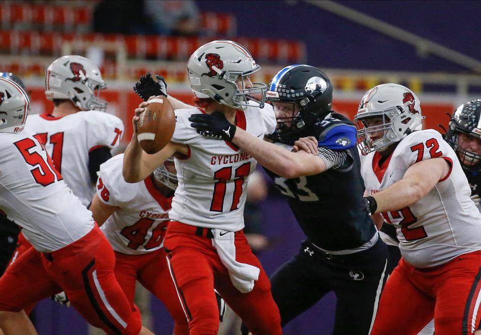 Harlan quarterback Teagon Kasperbauer tries to unload a pass against Boyden-Hull Rock Valley during the Class 3A state championship game on Nov. 19, 2021, in Cedar Falls.