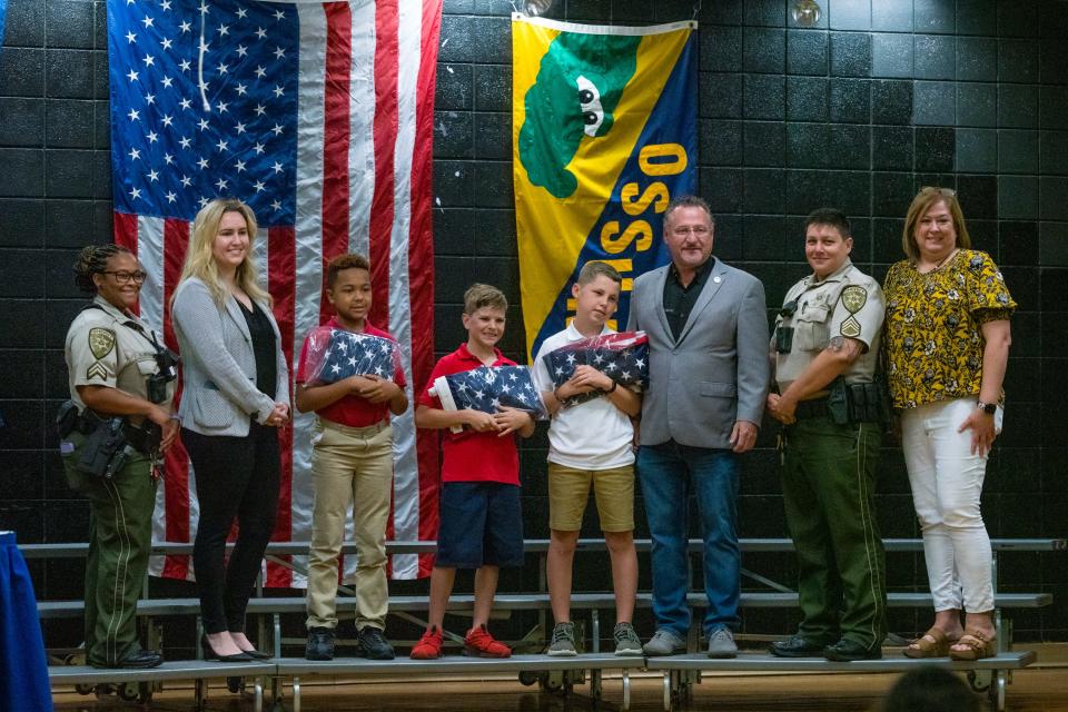 Students of Ossun Elementary's color guard group are commended for their service by Lafayette Parish Sheriff Deputies and presented an American flag by state Representatives on Friday, May 20, 2022.