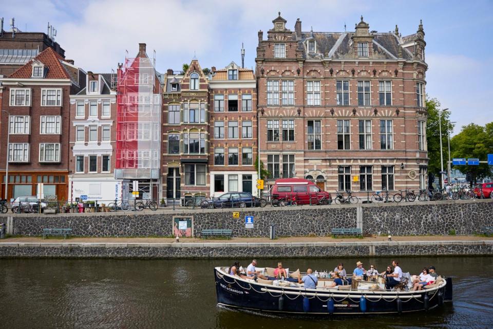 PHOTO: A tourist sightseeing boat navigating a canal in Amsterdam, Netherlands, Aug. 18, 2023.  ( Ksenia Kuleshova/Bloomberg via Getty Images)