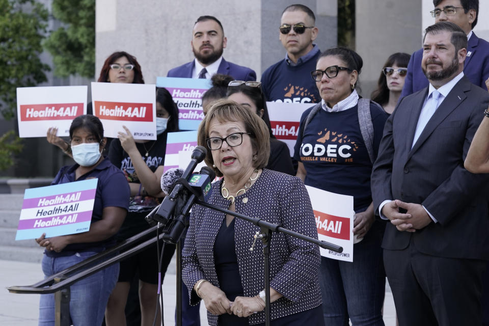 California state Sen, Maria Elena Durazo, D-Los Angeles, speaks in support of health care for all low-income immigrants living in the country illegally during a rally at the Capitol Sacramento, Calif., on Wednesday, June 29, 2022. Gov. Gavin Newsom is expected to sign a $307.9 billion operating budget on Thursday June 30, 2022, that makes all low-income adults eligible for the state's medicaid program regardless of their immigration status. (AP Photo/Rich Pedroncelli)