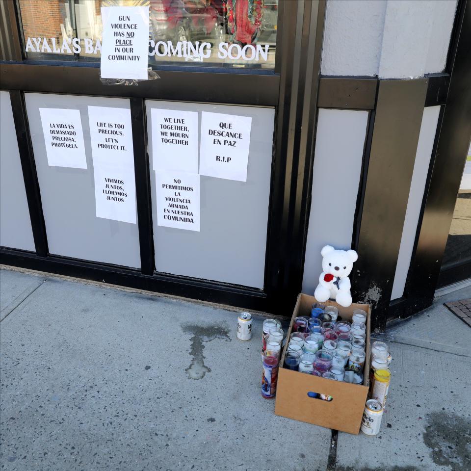 A memorial for a teenager that was shot by another teenager in New Rochelle, is pictured at the corner of Washington Avenue and Fourth Street in the city, Jan. 26, 2022. 