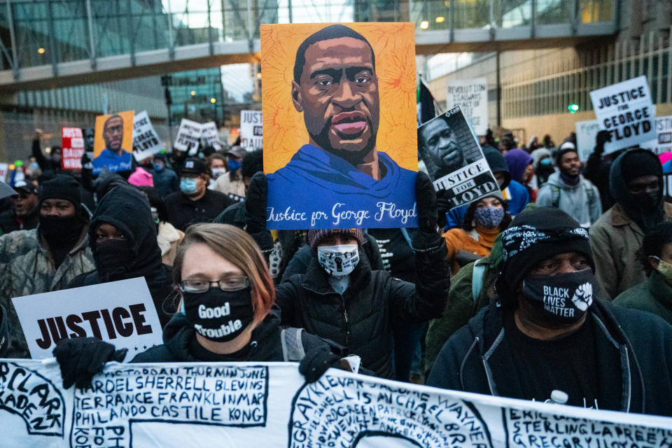 Protesters march around downtown Minneapolis near the courthouse calling for justice for George Floyd after closing arguments in the Chauvin trial has ended on Monday, April 19, 2021 in Minneapolis, MN. (Jason Armond/Los Angeles Times via Getty Images)