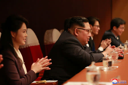 North Korean leader Kim Jong Un and his wife Ri Sol Ju watch South Korean K-pop singers perform in a concert under the title "Spring is Coming" at the Pyongyang Taekwondo Hall in North Korea in this photo released by North Korea's Korean Central News Agency (KCNA) in Pyongyang April 2, 2018. KCNA/via Reuters