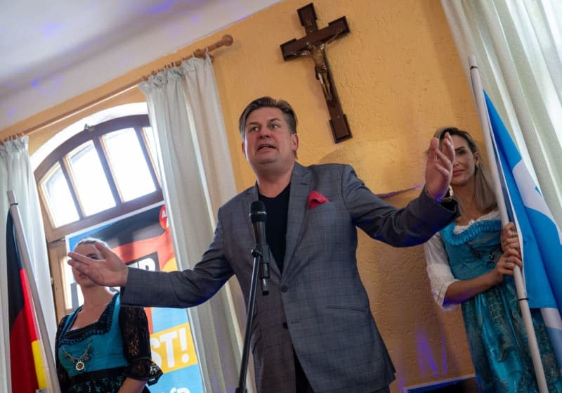Maximilian Krah, lead candidate of the Alternative for Germany (AfD) for the European elections, speaks in front of a crucifix during an election campaign event in Holzkirchen. Stefan Puchner/dpa