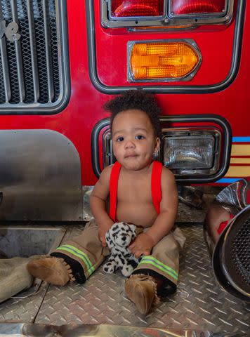 <p>Heather Shay Photography</p> Samuel Tyler visits fire station where he was surrendered