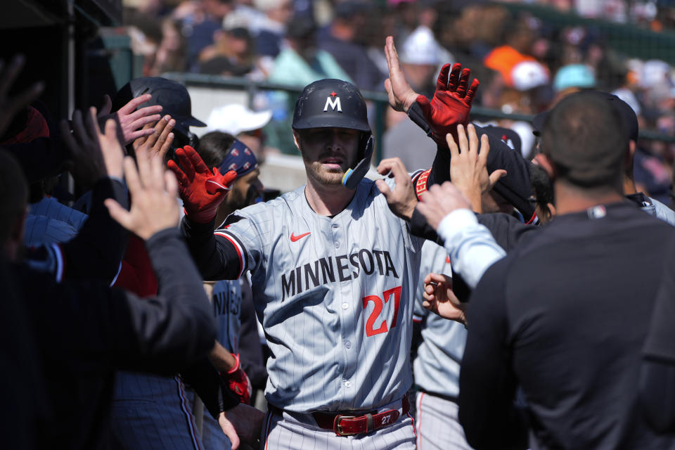 Minnesota Twins' Ryan Jeffers (27) celebrates his home run against the Detroit Tigers in the eighth inning during the first baseball game of a doubleheader, Saturday, April 13, 2024, in Detroit. (AP Photo/Paul Sancya)