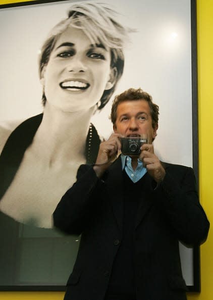 <div class="inline-image__caption"><p>Celebrity portrait photographer Mario Testino takes a picture of assembled journalists as he launches an exhibition of photographs that he captured of the late British Princess Diana in Kensington Palace in London, 22 November 2005.</p></div> <div class="inline-image__credit">CARL DE SOUZA/AFP via Getty Images</div>