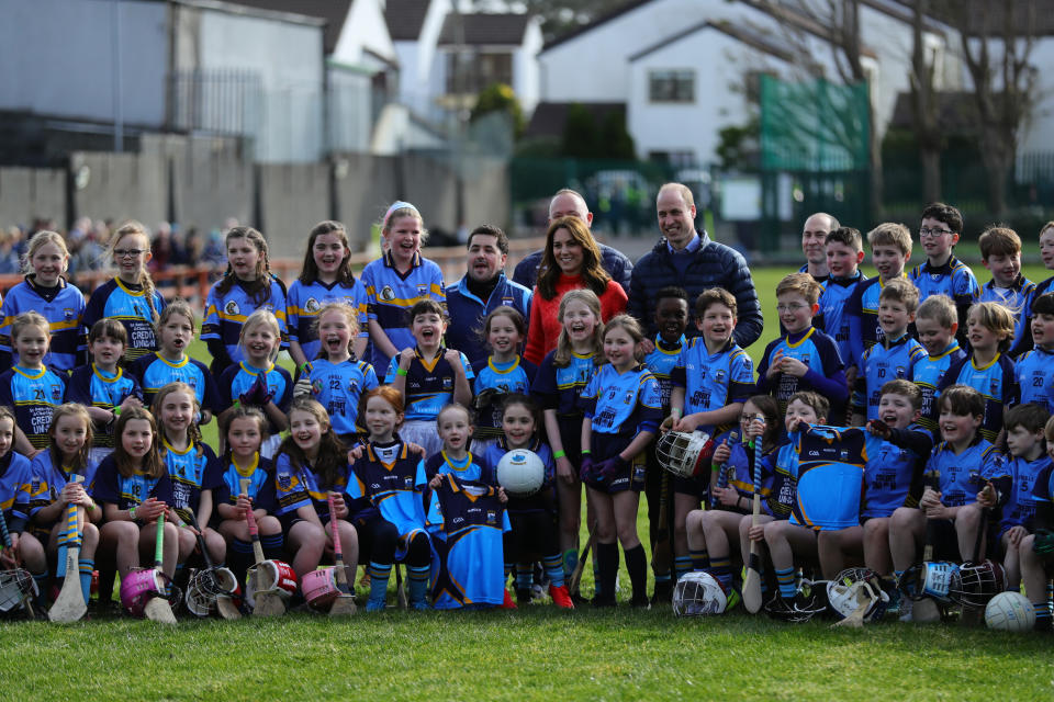 The Duke and Duchess of Cambridge poses for a group photograph during a visit to Salthill Knocknacarra GAA Club in Galway, where they will learn more about traditional sports during the third day of their visit to the Republic of Ireland. (Photo by Aaron Chown/PA Images via Getty Images)